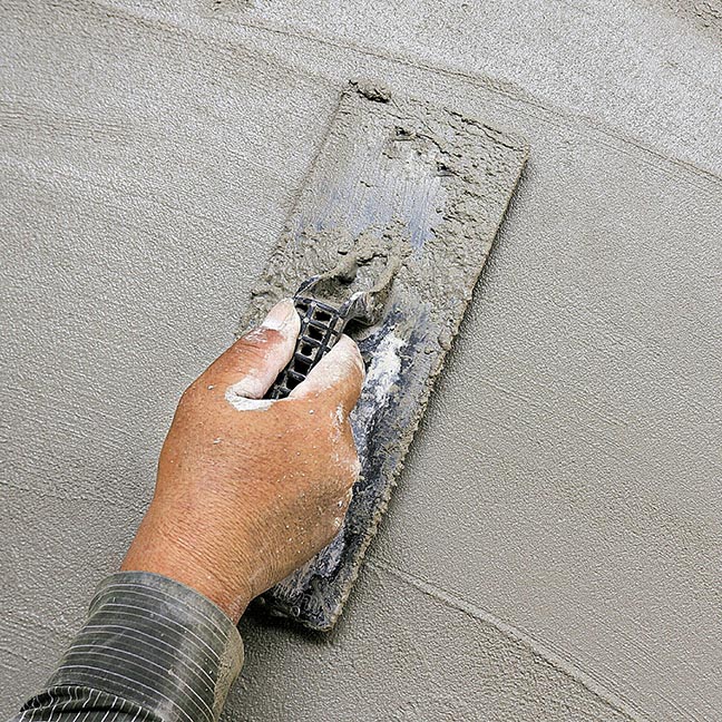 Cropped Hand On Worker Making Wall At Construction Site Cropped Hand On Worker Making Wall At Construction Site